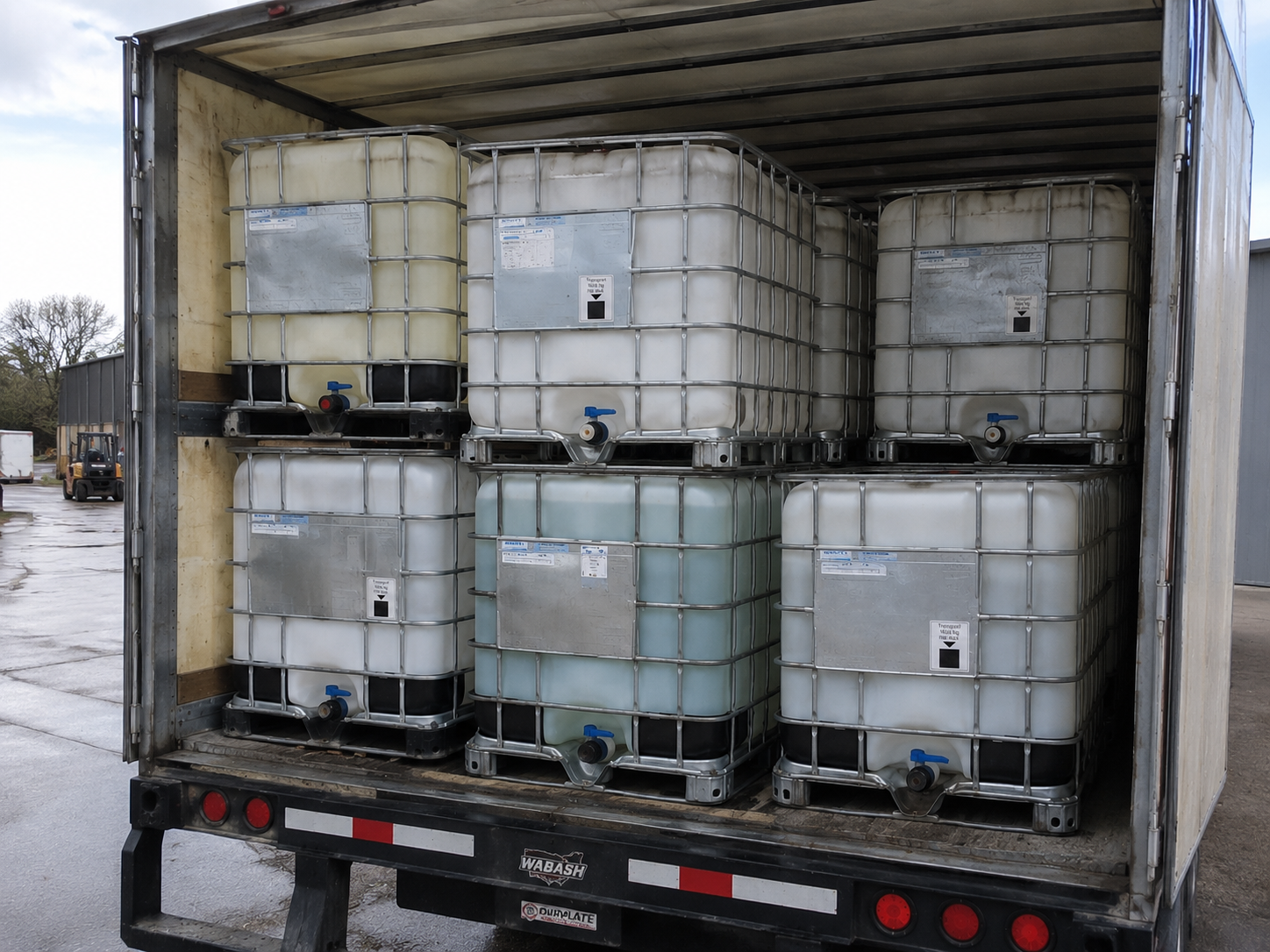 IBC totes loaded and secured inside a dry van trailer for nationwide freight