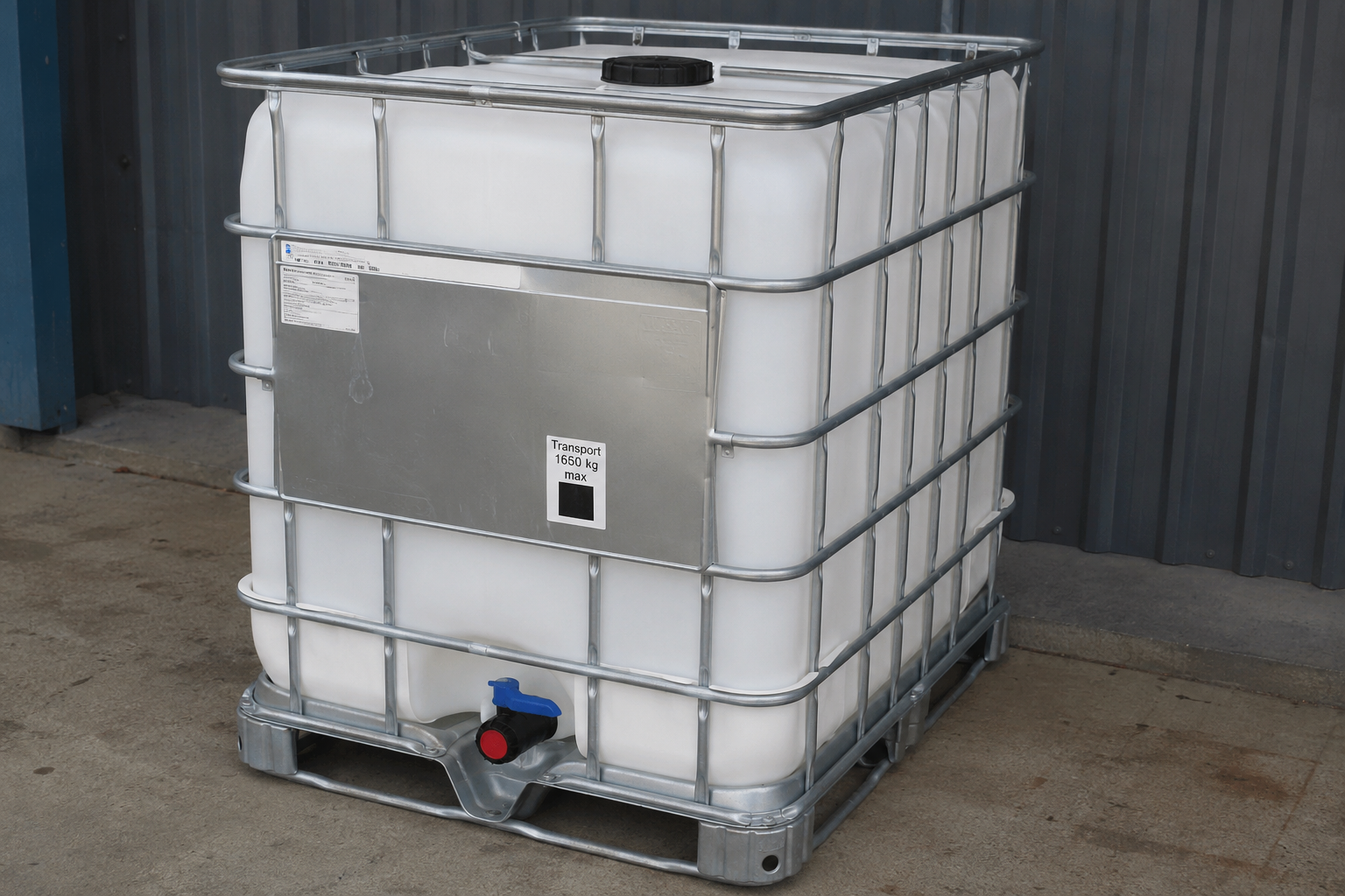 A clean, factory-fresh IBC tote with galvanized cage and pallet